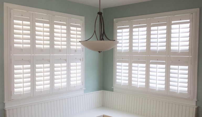 Soft green wall in New Brunswick kitchen with shutters.